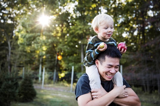 Father with son on his shoulders