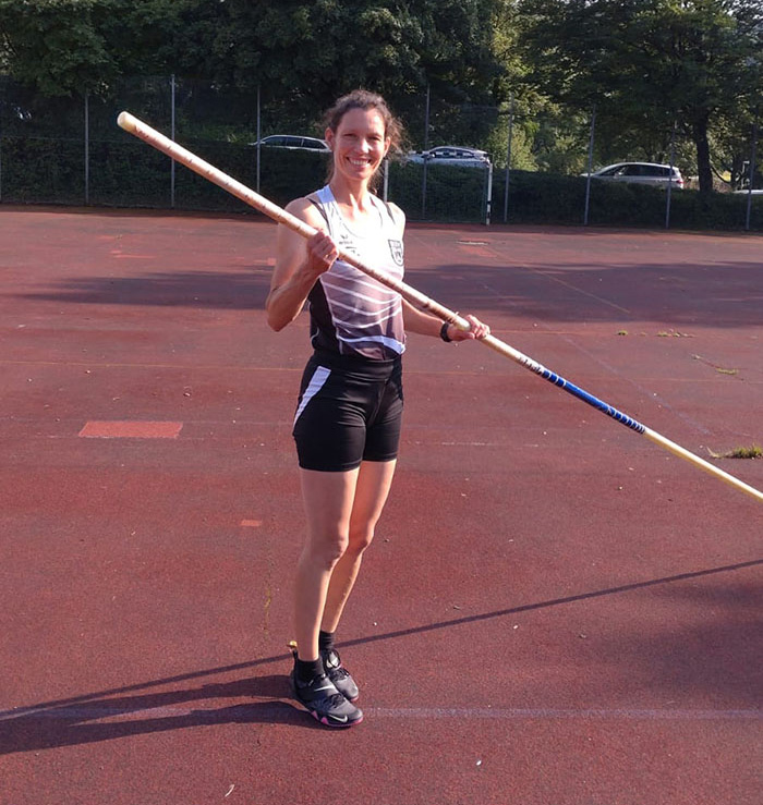 Melanie practicing pole vault.